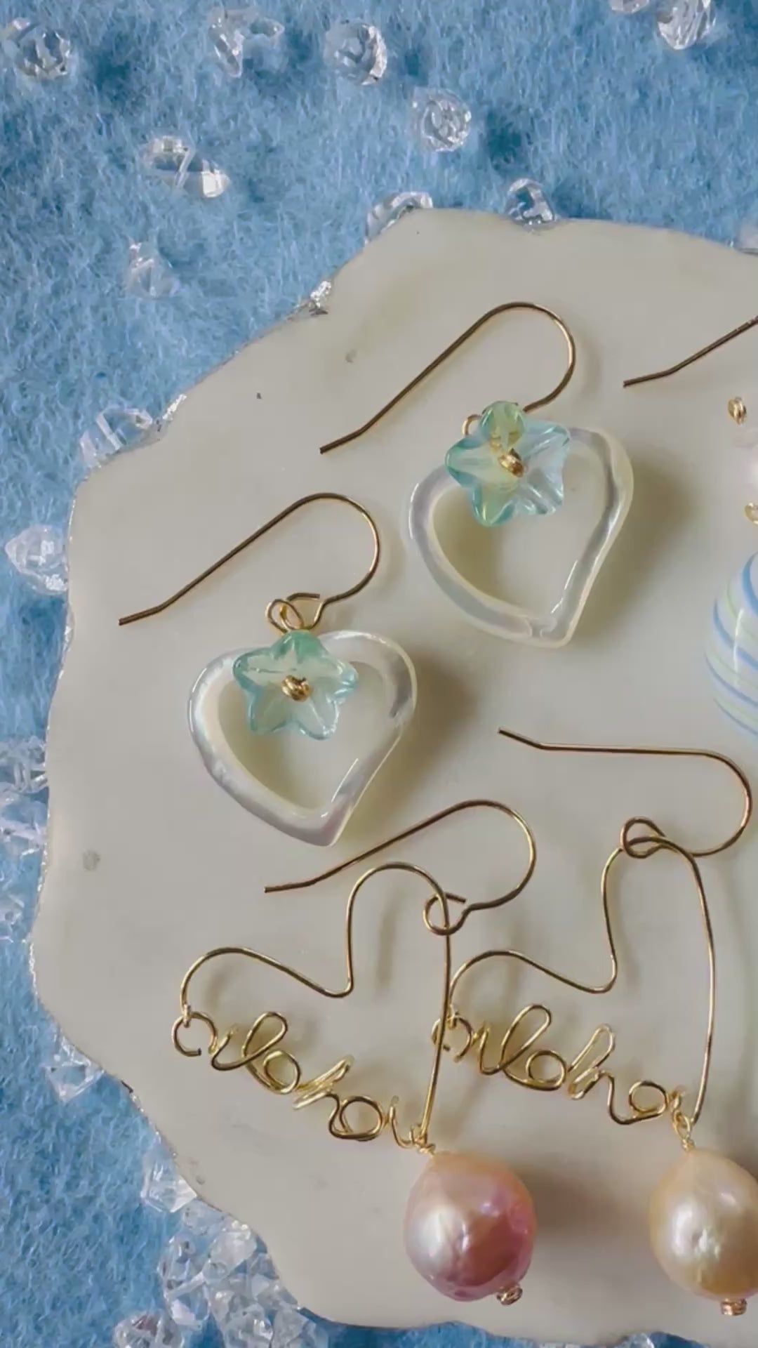 Load video: Plumeria Shell & Puff Glass Heart Earrings