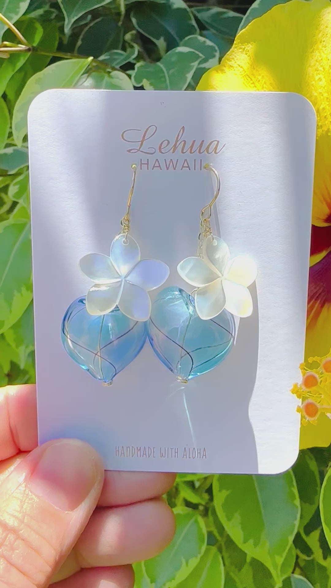 Load video: Plumeria Shell & Blue Heart Earrings