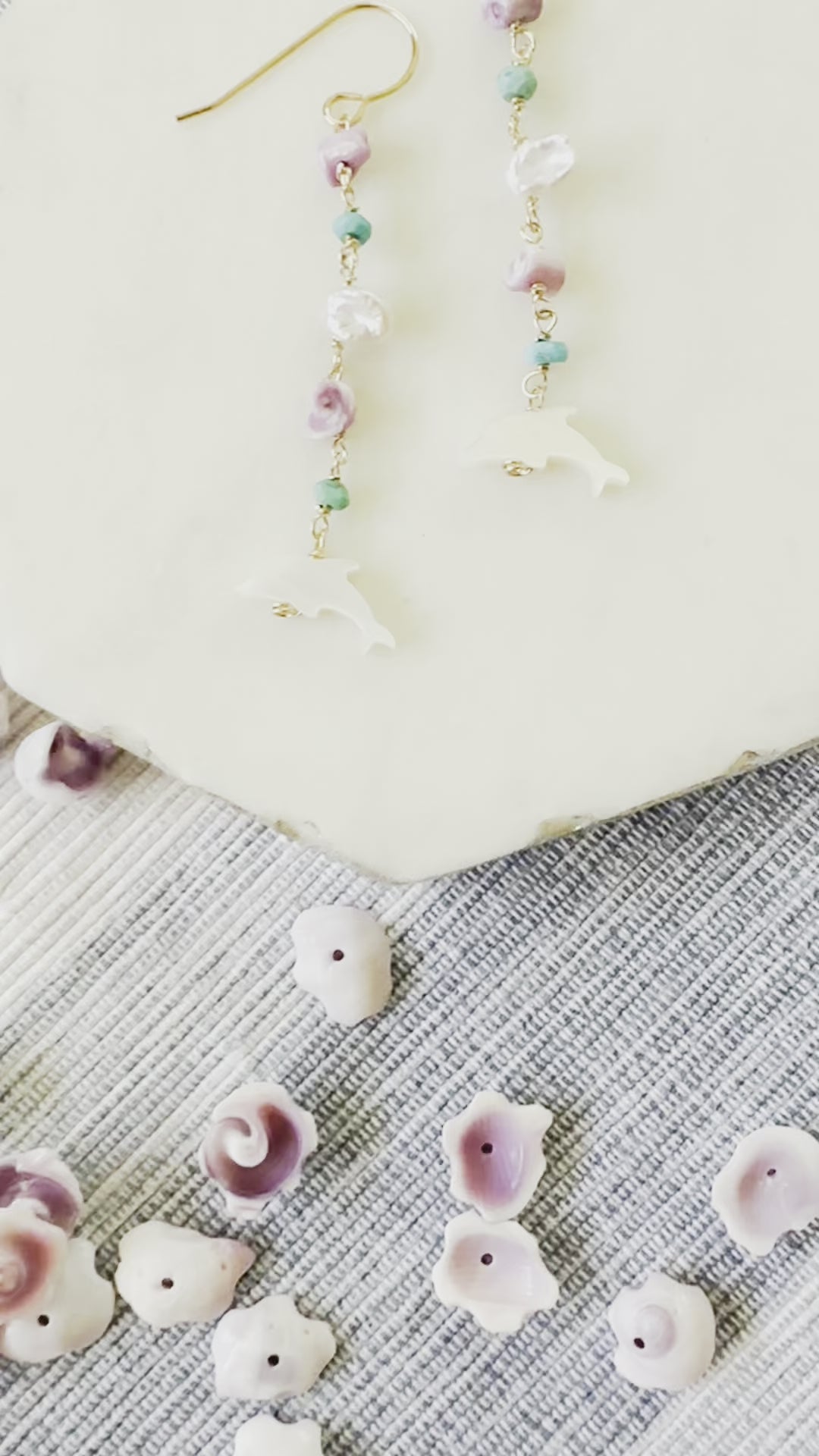 Load video: Dolphin Shell Earrings