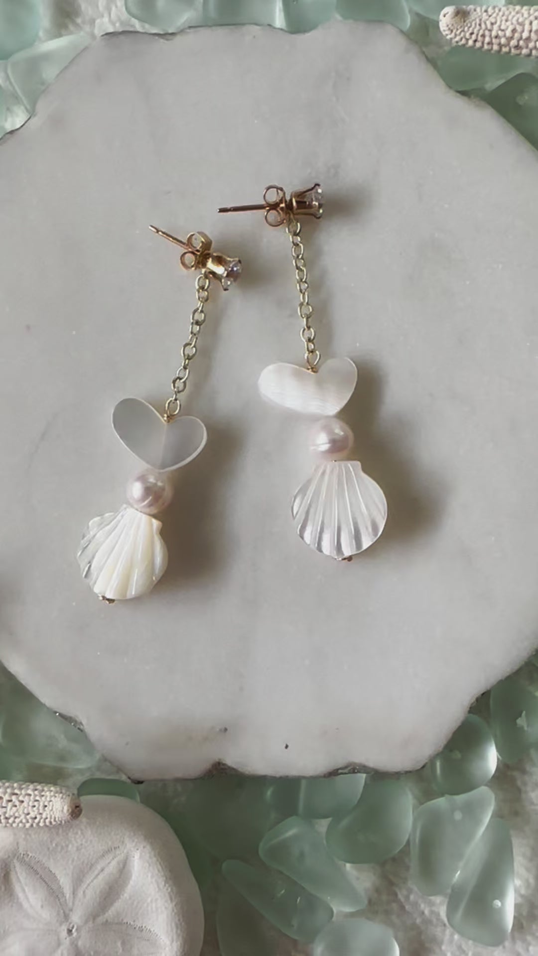 Load video: White Heart Shell Stud Earrings